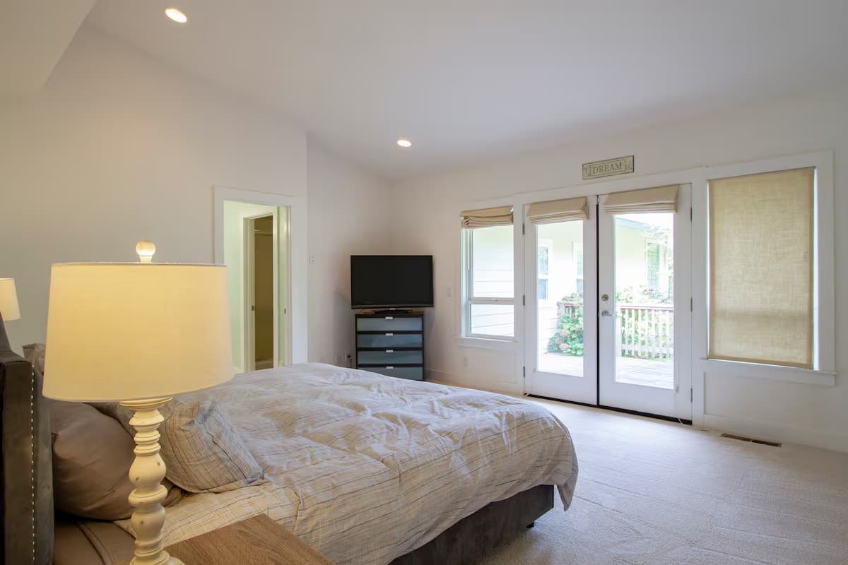 Bedroom opening to a private deck