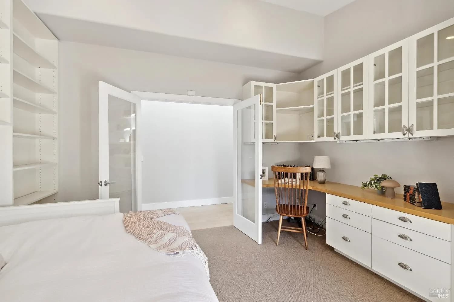 Guest bedroom with built-in desk and shelving