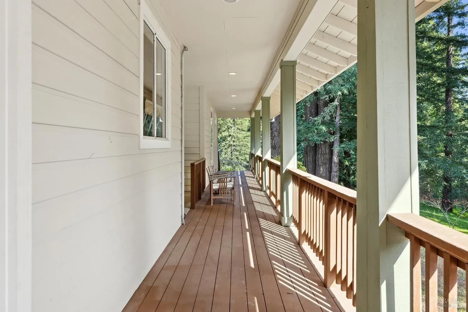 Long covered porch looking into the redwoods