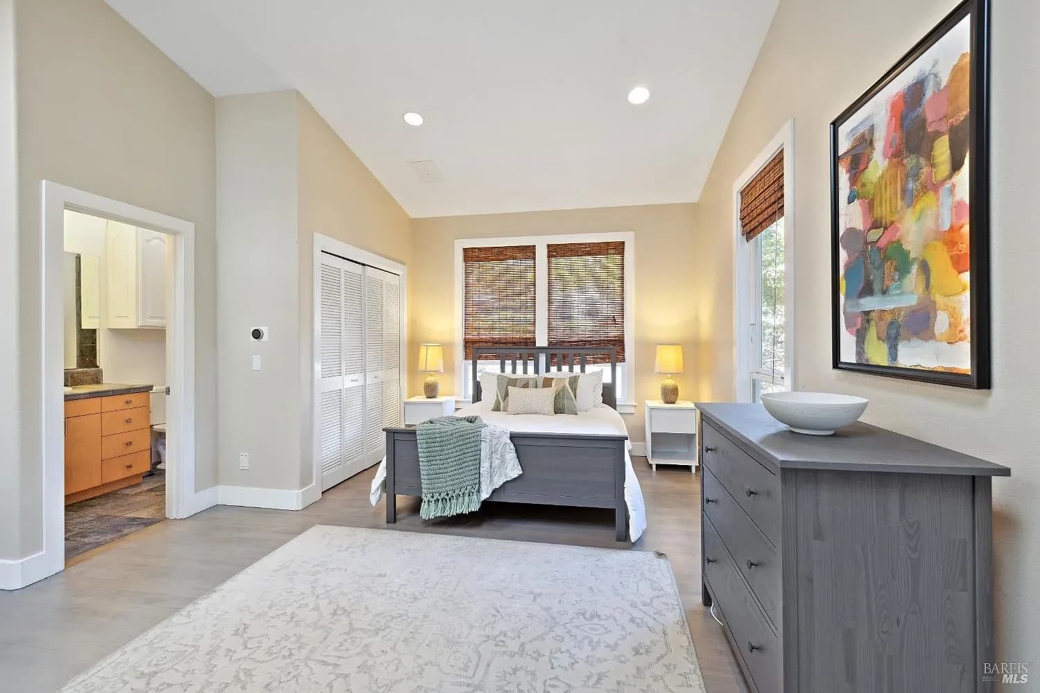 Guest bedroom with garden views and an adjacent bath